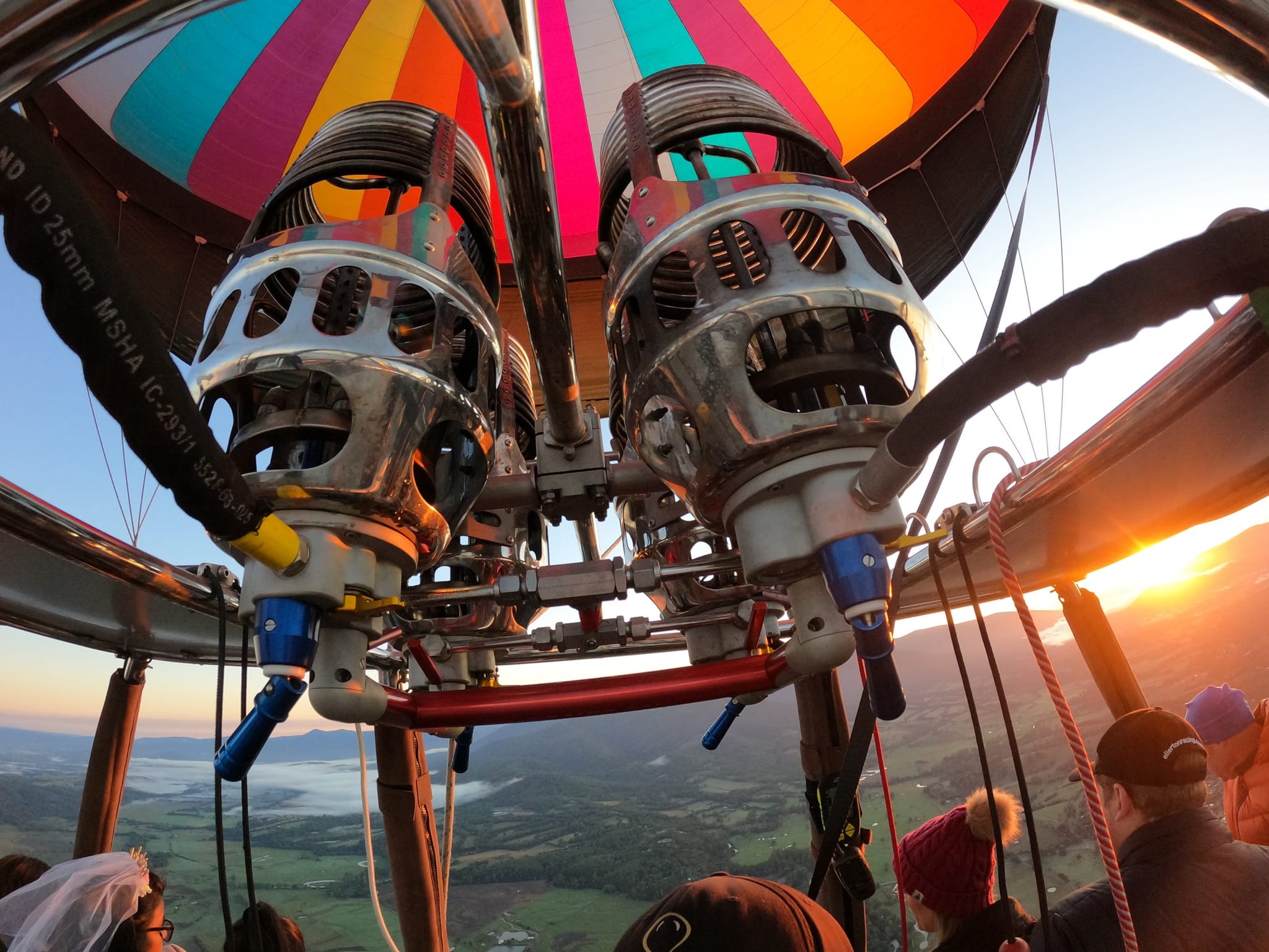 Hot air balloon burners lit at sunrise over the Yarra Valley