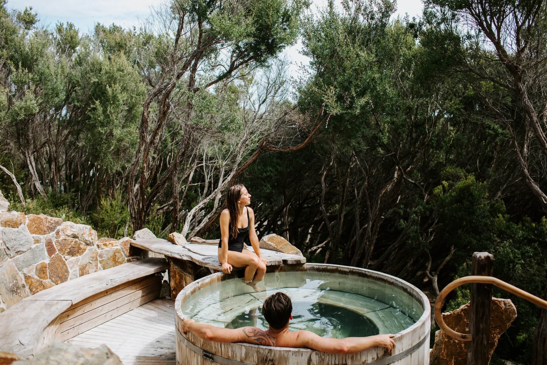 Two people enjoy a bath at the Peninsula Hot Springs. 